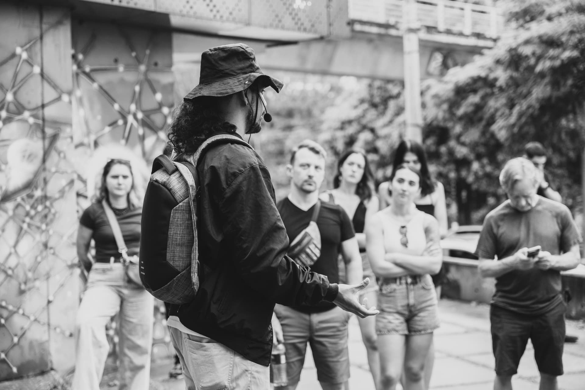 A guide sharing a story with a group of travelers